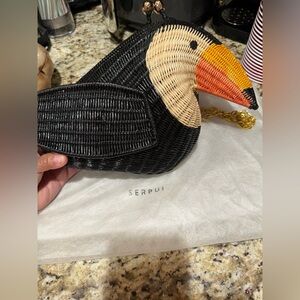 Keeping it instead. Too many low offers Serpui wicker toucan NWT flawed
